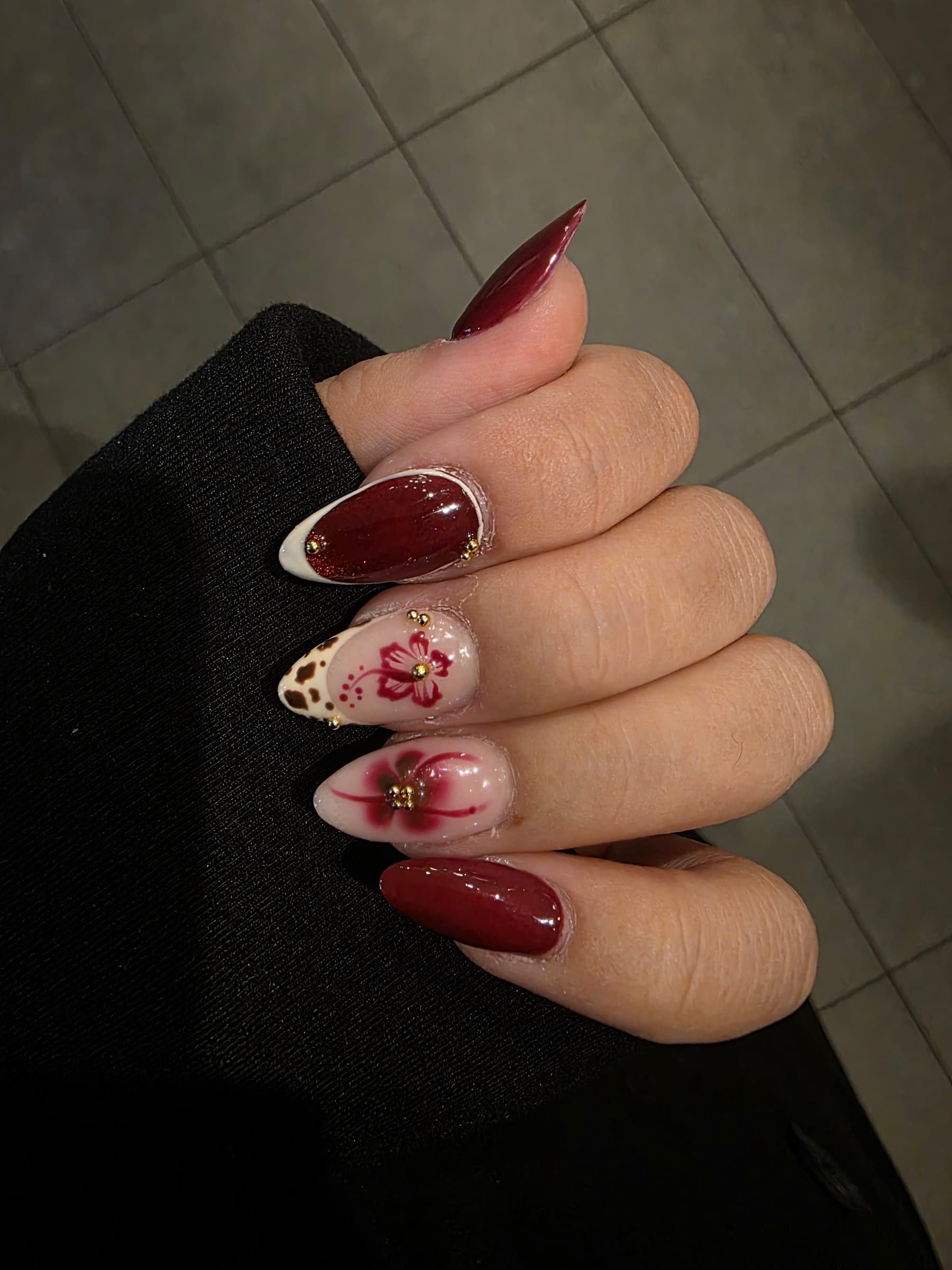Burgundy floral manicure by Blackrock Nails & Spa